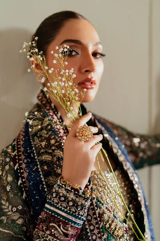 a model holding flowers in her hand